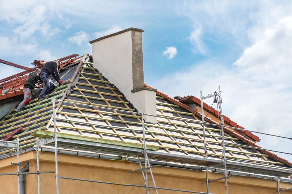 Roofers installing Roof